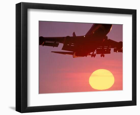 Airplane in Flight During Sunrise, Sunset-Mitch Diamond-Framed Photographic Print