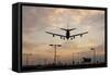 Airplane landing-Charles Bowman-Framed Stretched Canvas