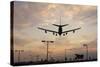 Airplane landing-Charles Bowman-Stretched Canvas