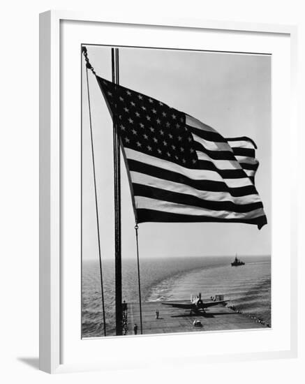 Airplane on Battleship Deck with American Flag in Foreground, World War II-null-Framed Photo