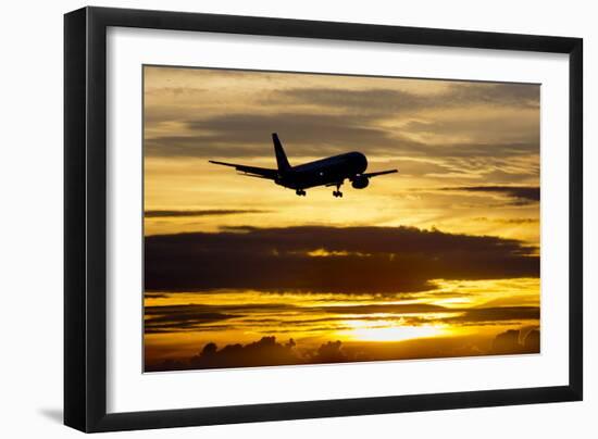 Airplane sunset-Charles Bowman-Framed Photographic Print