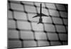 Airplane Through Fence B/W-null-Mounted Poster