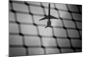 Airplane Through Fence B/W-null-Mounted Photo