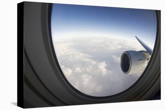 Airplane Window Looking Out on Cloudy Sky-Paul Souders-Stretched Canvas