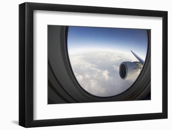 Airplane Window Looking Out on Cloudy Sky-Paul Souders-Framed Photographic Print