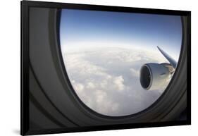 Airplane Window Looking Out on Cloudy Sky-Paul Souders-Framed Photographic Print