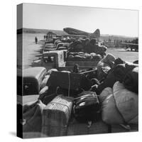 Airplanes Sitting on Airstrip at Airfield and Supplies Sitting in Trucks-Jack Birns-Stretched Canvas