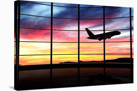 Airport Window with Airplane Flying at Sunset-viperagp-Stretched Canvas