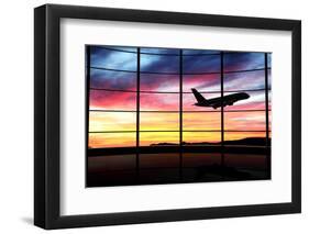 Airport Window with Airplane Flying at Sunset-viperagp-Framed Photographic Print