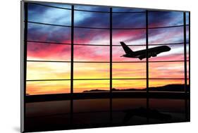 Airport Window with Airplane Flying at Sunset-viperagp-Mounted Photographic Print