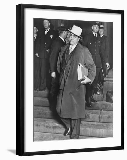 Al Capone, Winks at Photographers as He Leaves Chicago's Federal Courthouse-null-Framed Photo