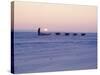 Alaska: Native Alaskan Moving on a Dog-Sled over the Ice, with the Midnight Sun in the Background-Ralph Crane-Stretched Canvas