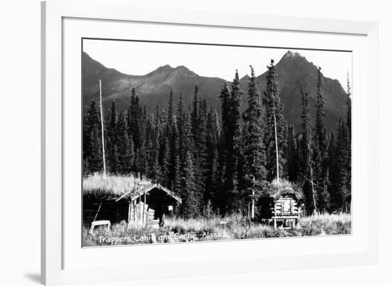 Alaska - View of Trapper's Cabin and Cache-Lantern Press-Framed Art Print