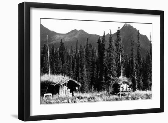 Alaska - View of Trapper's Cabin and Cache-Lantern Press-Framed Art Print