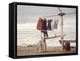 Alaskan Woman Hanging Her Laundry to Dry Along the Edge of an Ice Sheet-Ralph Crane-Framed Stretched Canvas