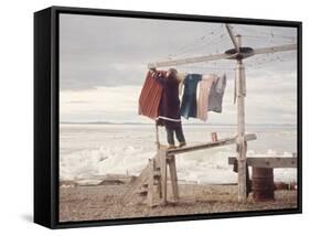 Alaskan Woman Hanging Her Laundry to Dry Along the Edge of an Ice Sheet-Ralph Crane-Framed Stretched Canvas