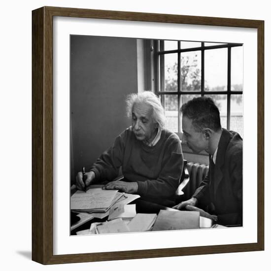 Albert Einstein, in Discussion with Robert Oppenheimer in Office Institute for Advanced Study-Alfred Eisenstaedt-Framed Premium Photographic Print