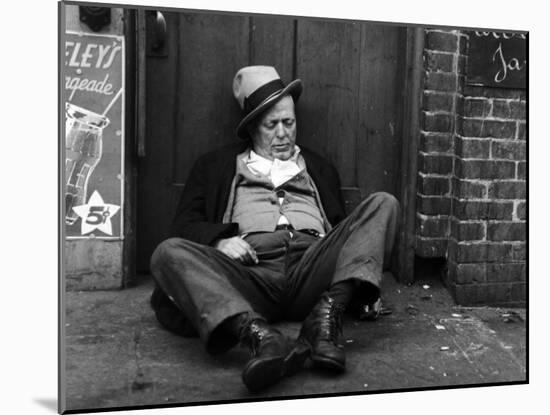 Alcoholic Vagrant Sleeping in a Doorway-null-Mounted Photographic Print