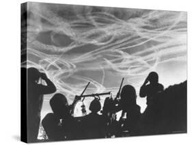 Alerted GIs of M 51 Anti Aircraft Battery Silhouetted Against German-M^s^ Kelly-Stretched Canvas