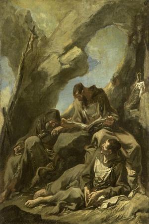 Three Capuchin Monks Meditating in Prayer before a Crucifix in a Cave