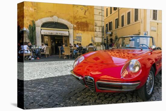 Alfa Romeo Duetto spider parked in a cobblestone street of Rome, Lazio, Italy-Stefano Politi Markovina-Stretched Canvas