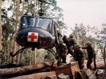 American 4th Battalion, 173rd Airborne Brigade Soldiers Loading Wounded Onto a "Huey" Helicopter-Alfred Batungbacal-Framed Stretched Canvas