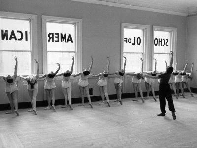 Dancers at George Balanchine's School of American Ballet Lined Up at Barre During Training