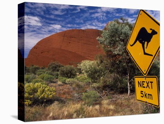 Alice Springs, Traffic Sign Beside Road Through Outback, Red Rocks of Olgas Behind, Australia-Amar Grover-Stretched Canvas