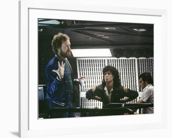 Alien, 1979 directed by Ridley Scott On the set; the director (Ridley Scott) with Sigourney Weaver -null-Framed Photo