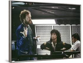 Alien, 1979 directed by Ridley Scott On the set; the director (Ridley Scott) with Sigourney Weaver -null-Framed Photo