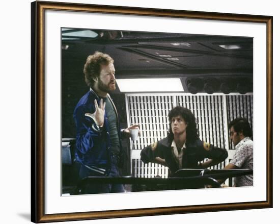 Alien, 1979 directed by Ridley Scott On the set; the director (Ridley Scott) with Sigourney Weaver -null-Framed Photo