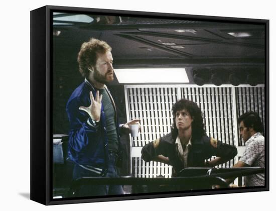 Alien, 1979 directed by Ridley Scott On the set; the director (Ridley Scott) with Sigourney Weaver -null-Framed Stretched Canvas