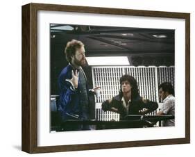 Alien, 1979 directed by Ridley Scott On the set; the director (Ridley Scott) with Sigourney Weaver -null-Framed Photo