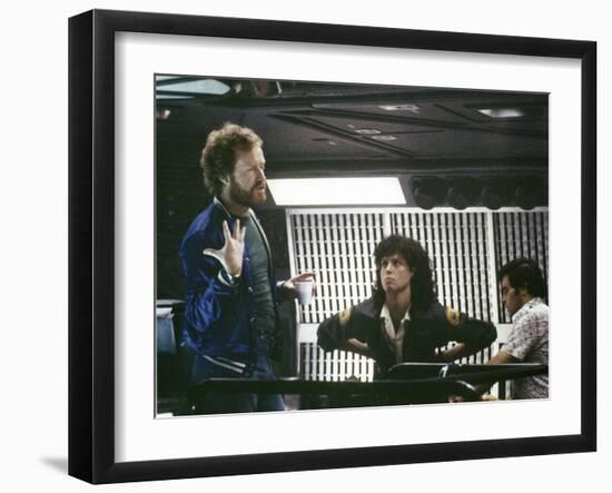 Alien, 1979 directed by Ridley Scott On the set; the director (Ridley Scott) with Sigourney Weaver -null-Framed Photo