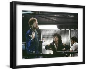 Alien, 1979 directed by Ridley Scott On the set; the director (Ridley Scott) with Sigourney Weaver -null-Framed Photo