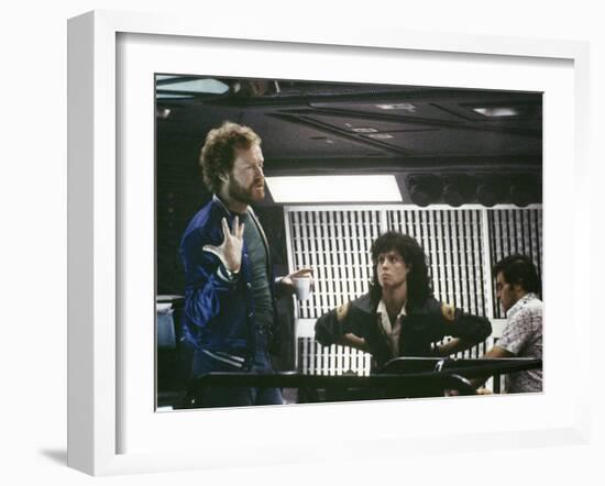 Alien, 1979 directed by Ridley Scott On the set; the director (Ridley Scott) with Sigourney Weaver -null-Framed Photo