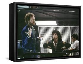 Alien, 1979 directed by Ridley Scott On the set; the director (Ridley Scott) with Sigourney Weaver -null-Framed Stretched Canvas