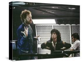 Alien, 1979 directed by Ridley Scott On the set; the director (Ridley Scott) with Sigourney Weaver -null-Stretched Canvas