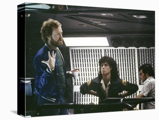 Alien, 1979 directed by Ridley Scott On the set; the director (Ridley Scott) with Sigourney Weaver -null-Stretched Canvas