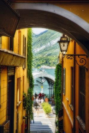 https://imgc.allpostersimages.com/img/posters/alley-with-a-lake-view-bellagio-lake-como-italy_u-L-Q1ICEE50.jpg?artPerspective=n