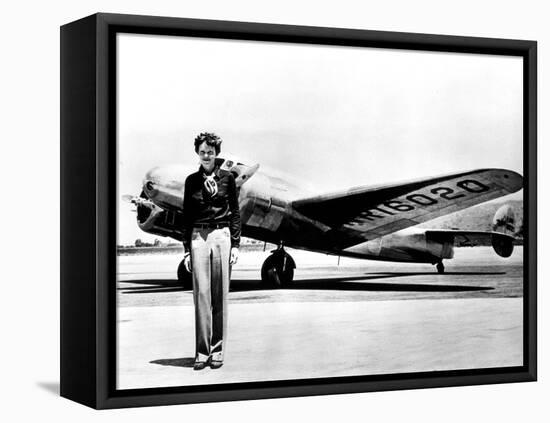 Amelia Earhart Standing in Front of the Lockheed Electra in Which She Disappeared in July 29, 1937-null-Framed Stretched Canvas