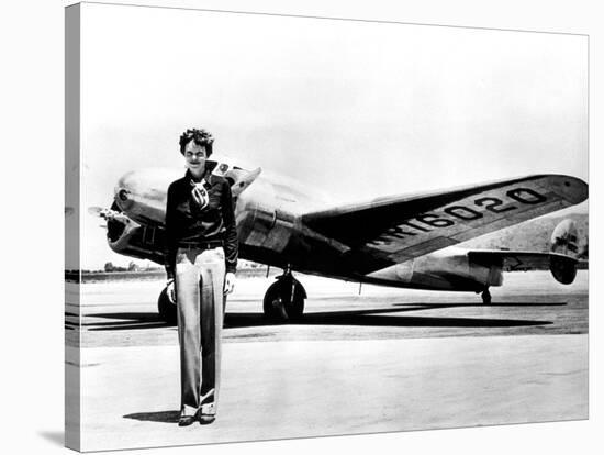 Amelia Earhart Standing in Front of the Lockheed Electra in Which She Disappeared in July 29, 1937-null-Stretched Canvas