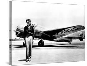 Amelia Earhart Standing in Front of the Lockheed Electra in Which She Disappeared in July 29, 1937-null-Stretched Canvas