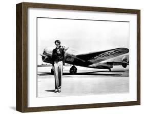 Amelia Earhart Standing in Front of the Lockheed Electra in Which She Disappeared in July 29, 1937-null-Framed Photo