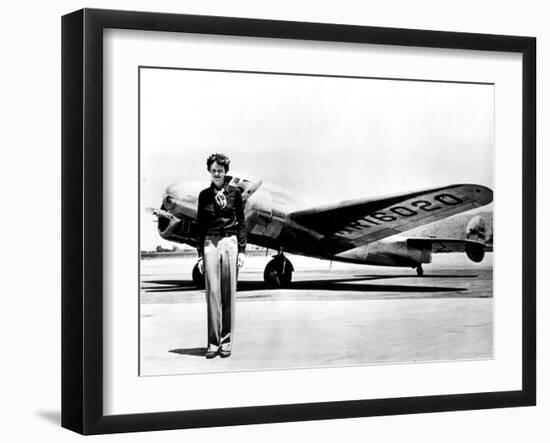 Amelia Earhart Standing in Front of the Lockheed Electra in Which She Disappeared in July 29, 1937-null-Framed Photo