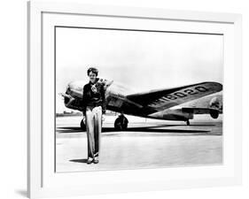 Amelia Earhart Standing in Front of the Lockheed Electra in Which She Disappeared in July 29, 1937-null-Framed Photo