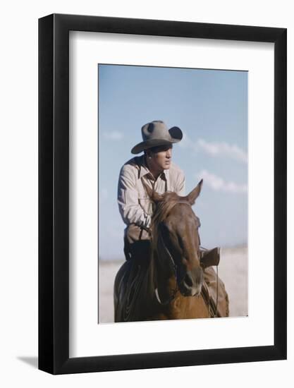 American Actor Rock Hudson on a Horse During the Filming of 'Giant', Near Marfa, Texas, 1955-Allan Grant-Framed Photographic Print