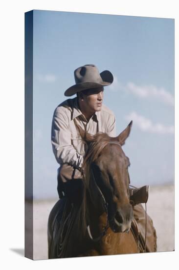 American Actor Rock Hudson on a Horse During the Filming of 'Giant', Near Marfa, Texas, 1955-Allan Grant-Stretched Canvas