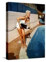 American Actress Jayne Mansfield with a Bottle of Champagne, Near a Swimming Pool, 1956-1957-null-Stretched Canvas