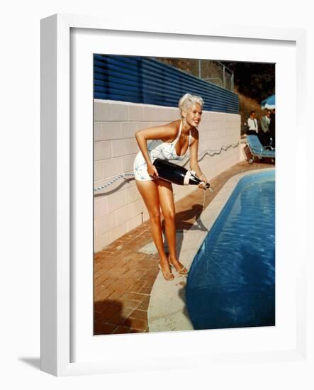 American Actress Jayne Mansfield with a Bottle of Champagne, Near a Swimming Pool, 1956-1957-null-Framed Photo